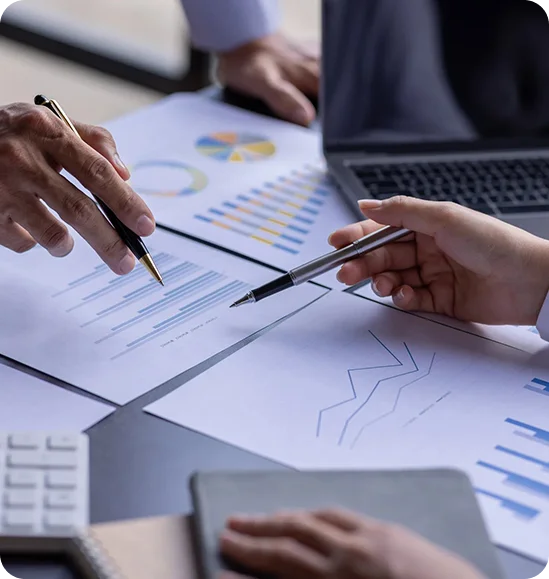 Business people reviewing financial charts.