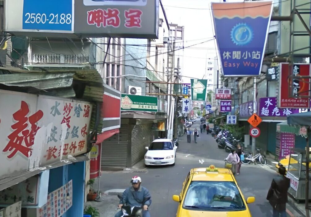 Busy Taiwanese street scene with shops.